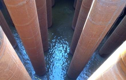 Image of structural poles coming out from the water